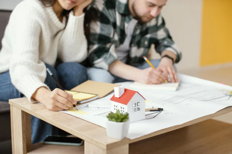 Couple reviewing home buying checklist for 2025 real estate purchase
